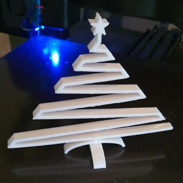Funny swinging Christmas tree with star